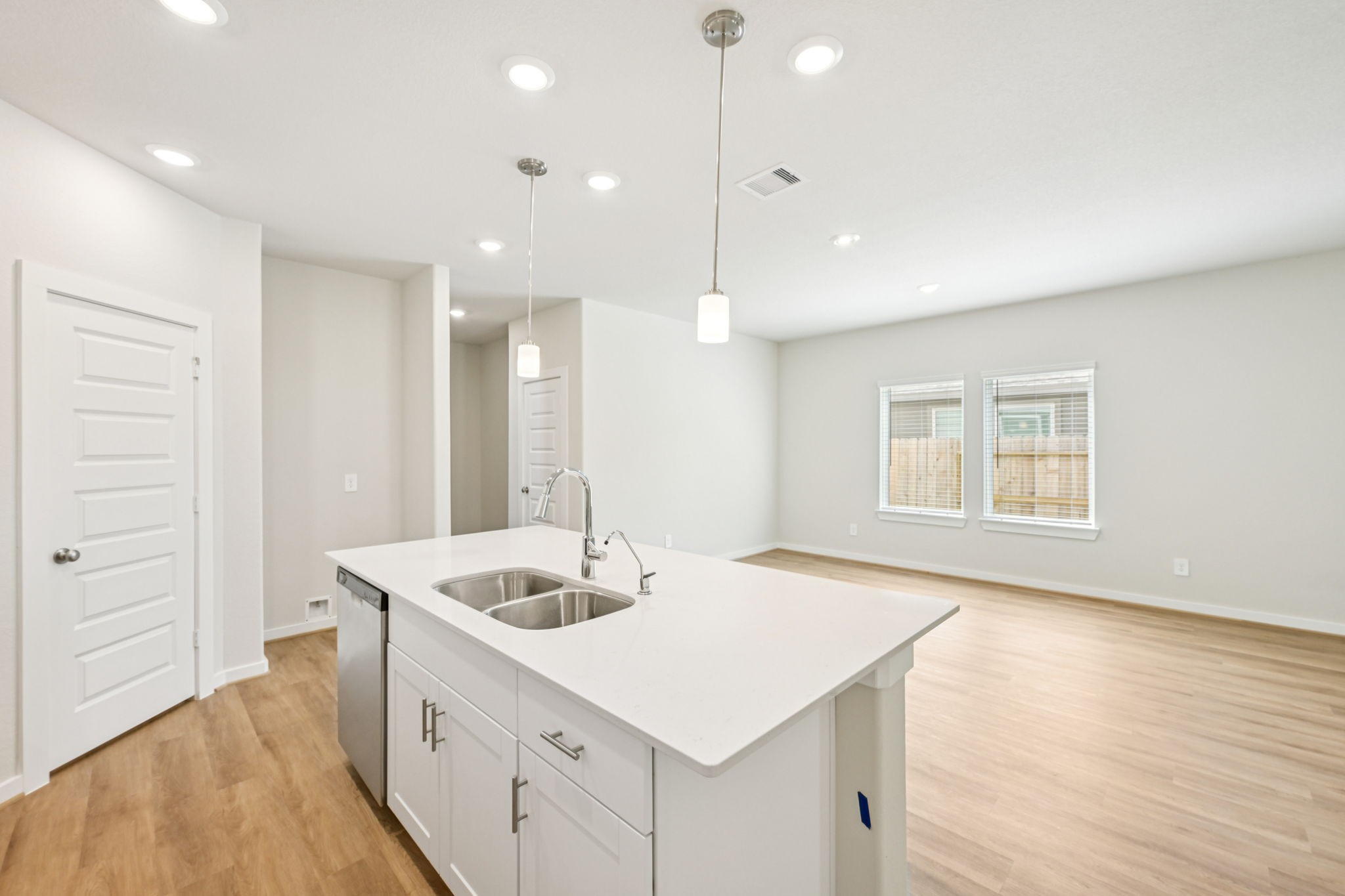 1653 Hopson Ranch Drive Conroe, TX 77301 - Photo 4 of 38 a bathroom with a sink double vanity and a mirror
