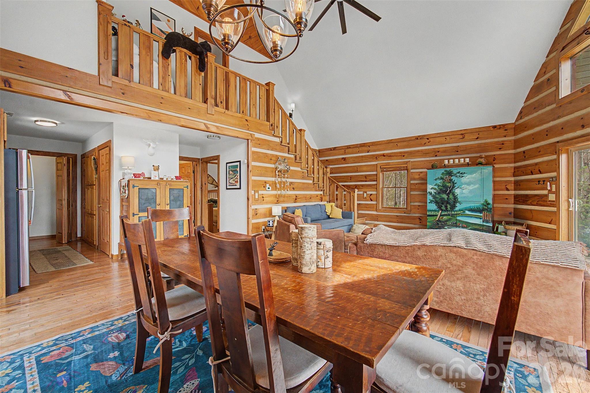 183 Ridge Place Bryson City, NC 28713 - Photo 13 of 44 a view of a dining room with furniture window and wooden floor