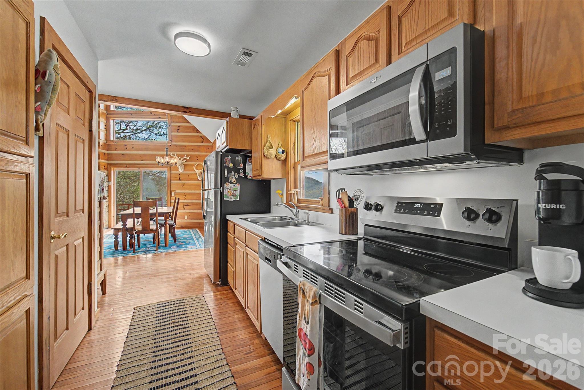 183 Ridge Place Bryson City, NC 28713 - Photo 16 of 44 a kitchen with a stove and a sink