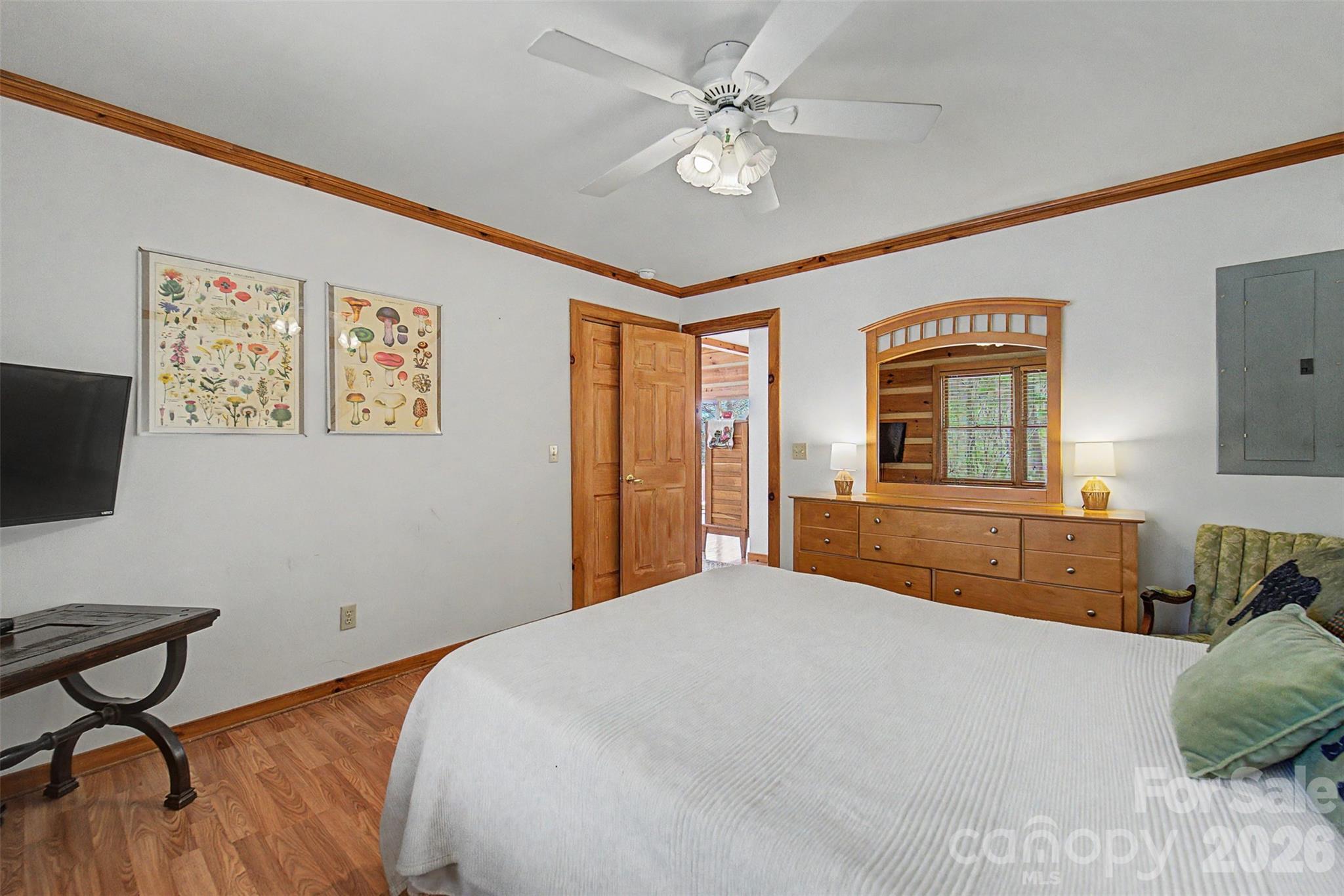 183 Ridge Place Bryson City, NC 28713 - Photo 19 of 44 a bedroom with a bed dresser and a window