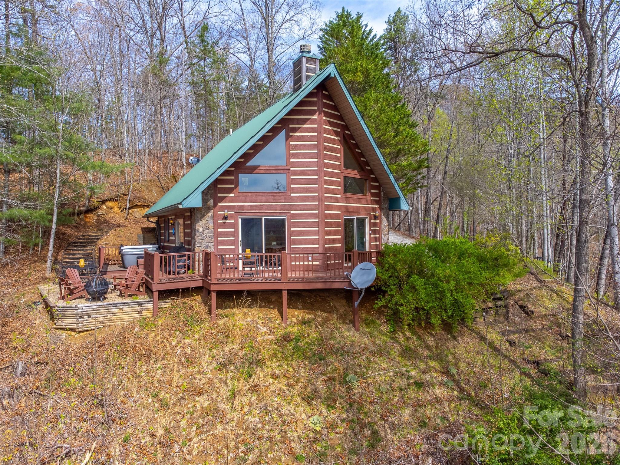 183 Ridge Place Bryson City, NC 28713 - Photo 2 of 44 a front view of a house with garden
