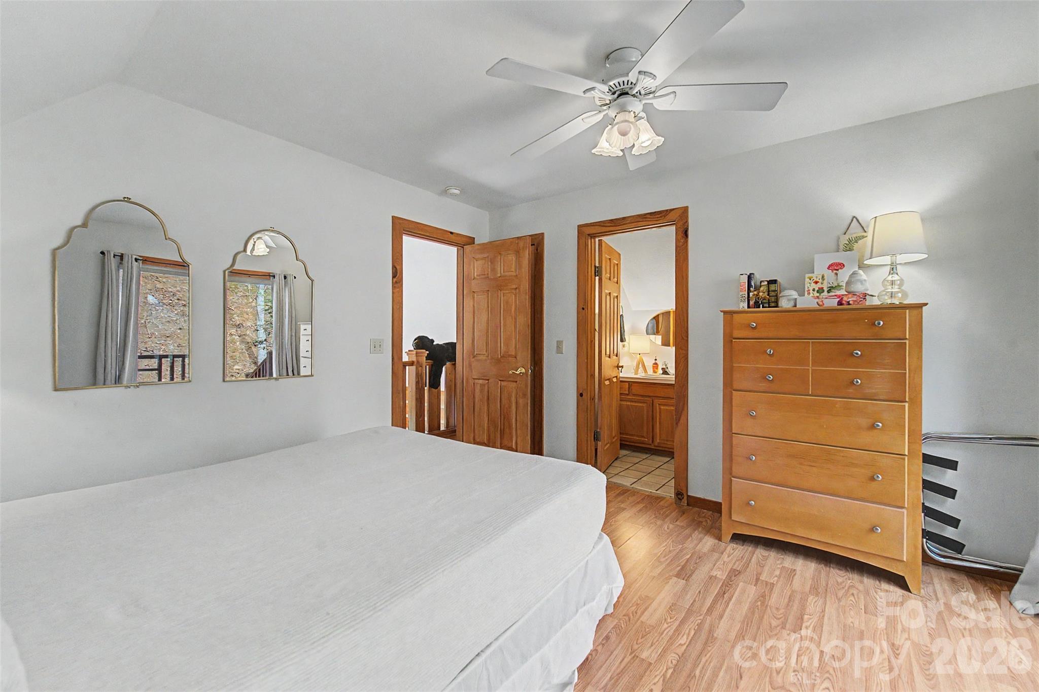 183 Ridge Place Bryson City, NC 28713 - Photo 23 of 44 a bedroom with a bed and a dresser