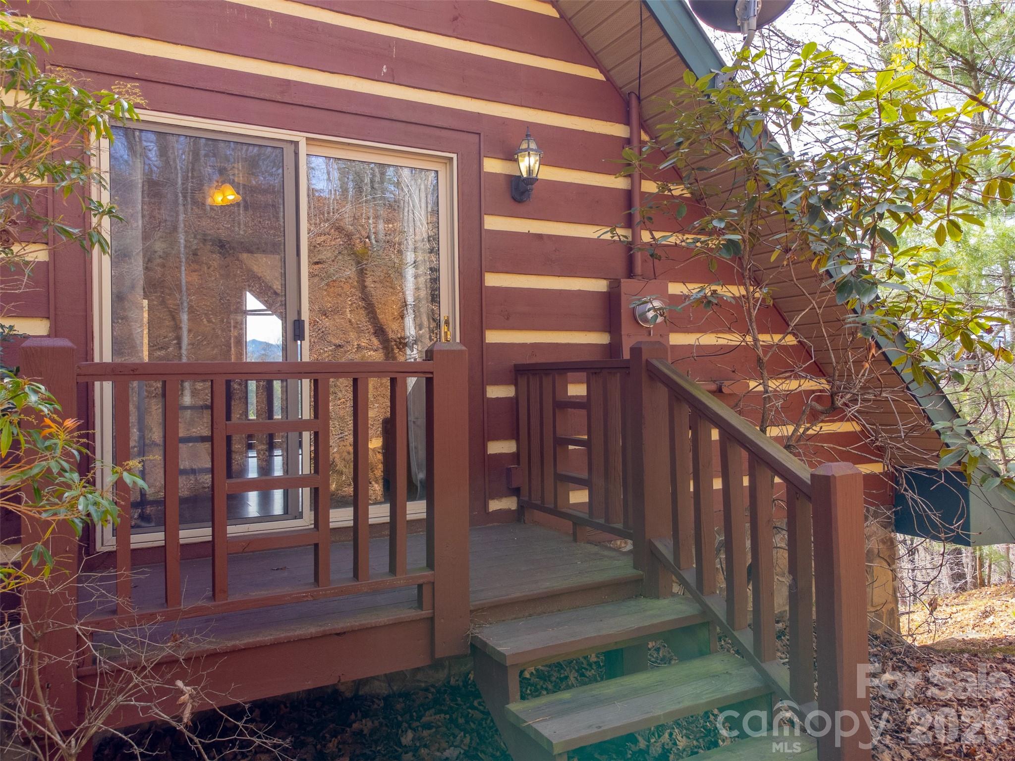 183 Ridge Place Bryson City, NC 28713 - Photo 30 of 44 a view of a brick house with a small yard