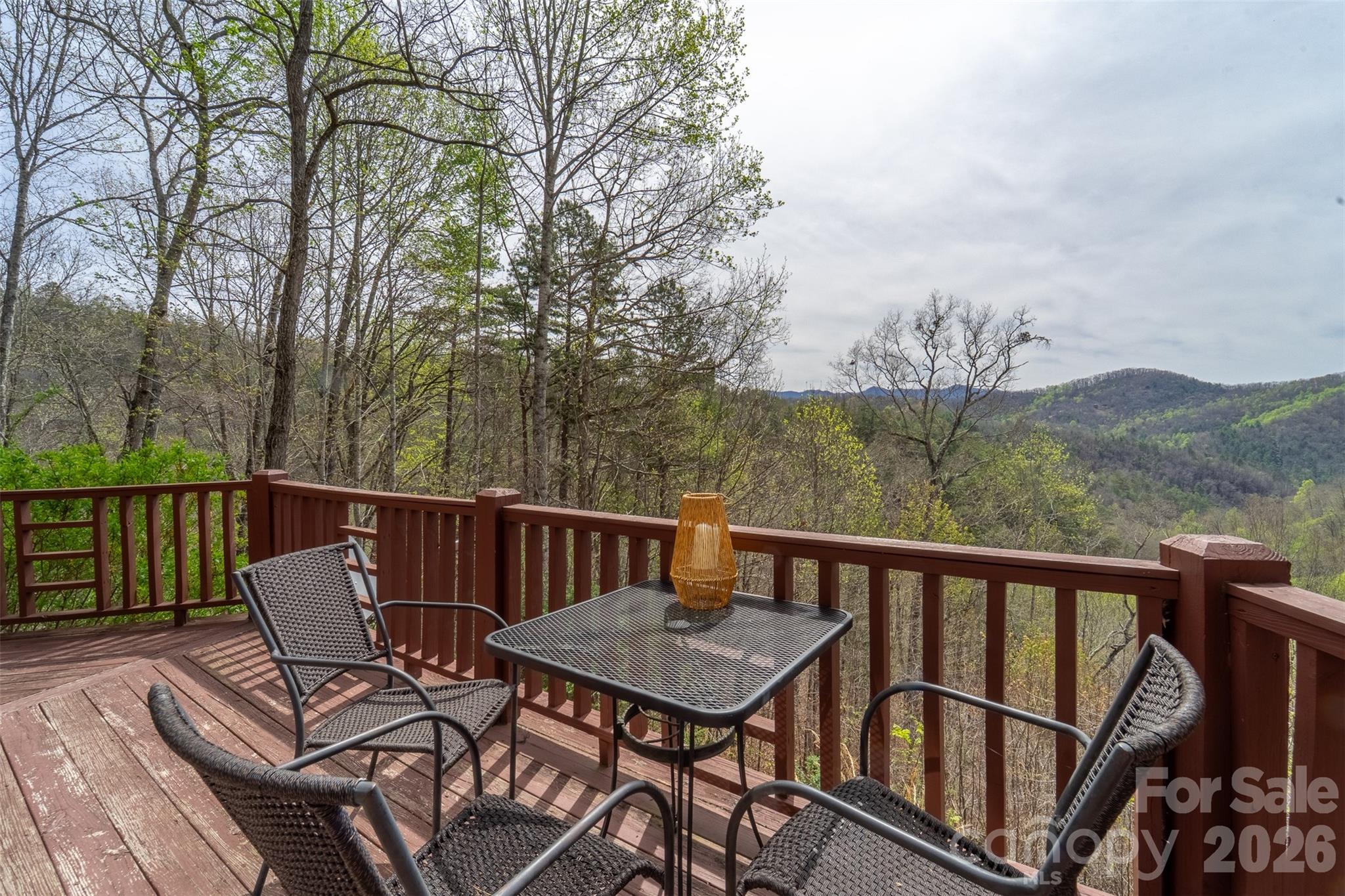 183 Ridge Place Bryson City, NC 28713 - Photo 31 of 44 a view of a balcony with wooden floor and outdoor seating