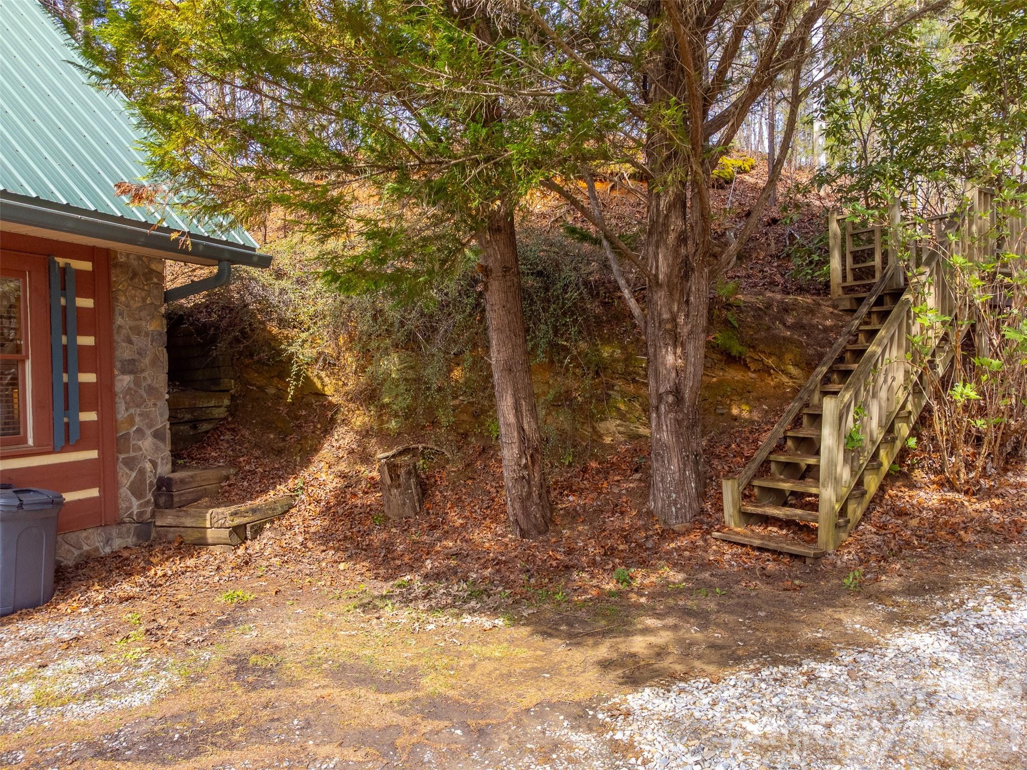183 Ridge Place Bryson City, NC 28713 - Photo 36 of 44 a backyard of a house with lots of green space
