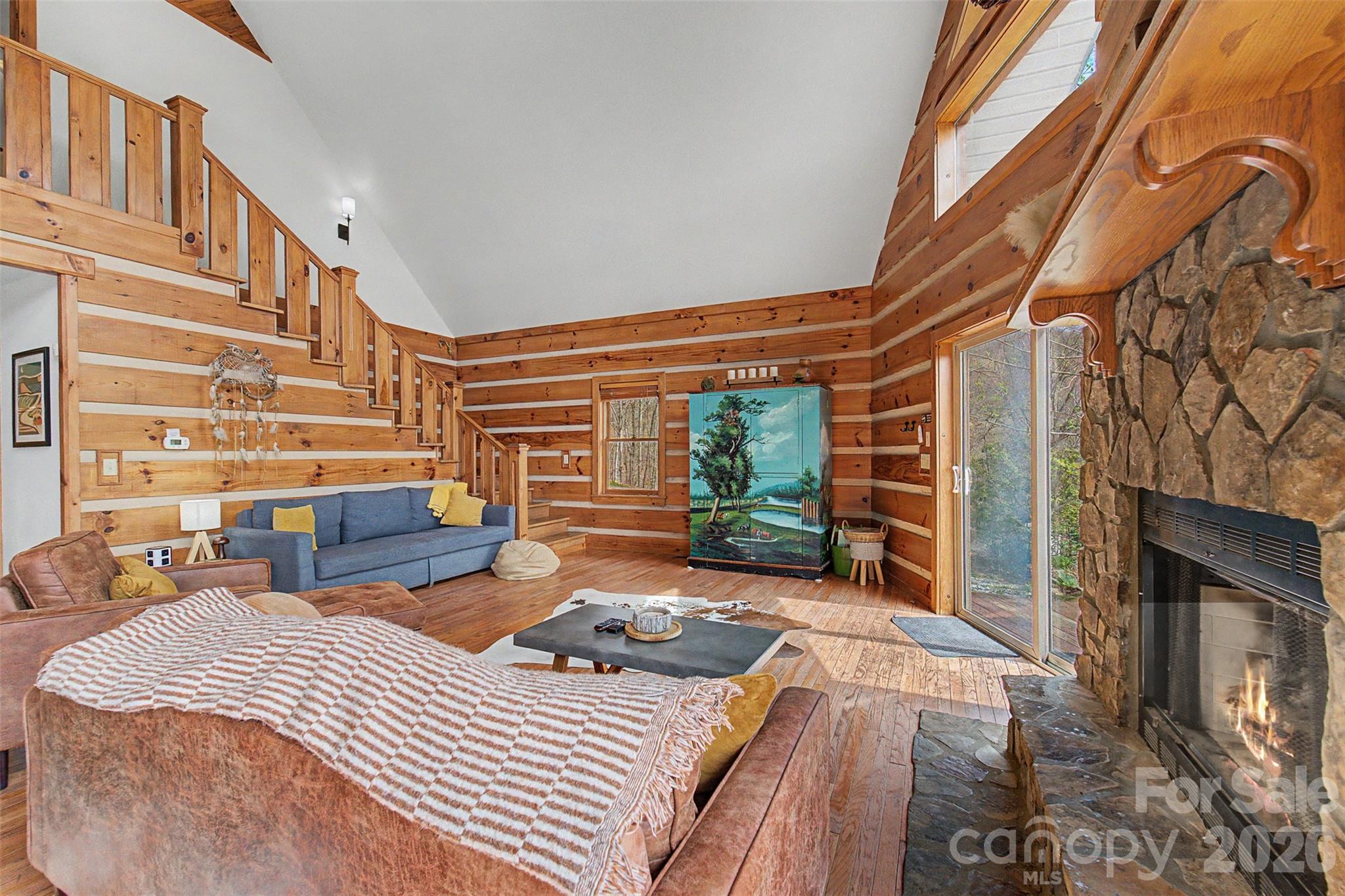 183 Ridge Place Bryson City, NC 28713 - Photo 9 of 44 a bedroom with bed and balcony