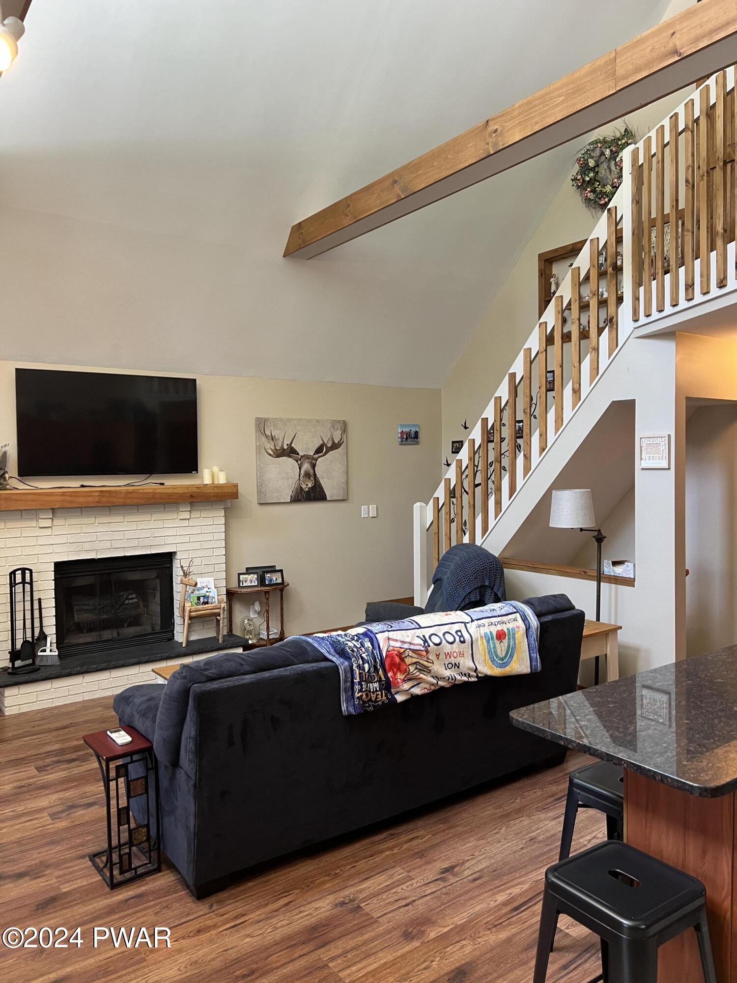 207 Maple Ridge Drive Hawley, PA 18428 - Photo 8 of 27 a living room with furniture and a fireplace