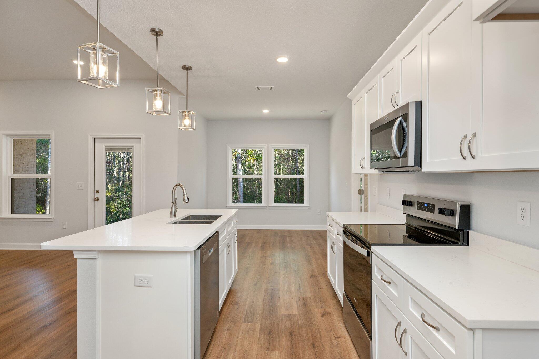 2614 Sorrel Ridge Road Crestview, FL 32536 - Photo 13 of 35 a kitchen with a sink stove and cabinets