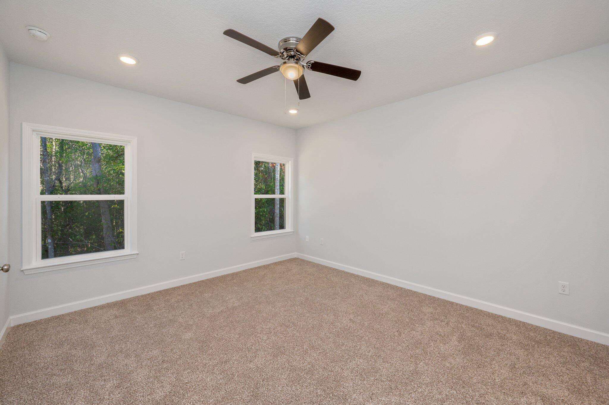2614 Sorrel Ridge Road Crestview, FL 32536 - Photo 15 of 35 an empty room with a window and a ceiling fan