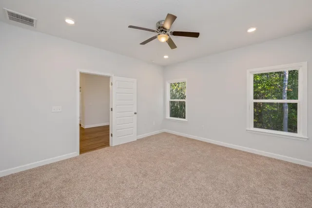 a view of an empty room with a window