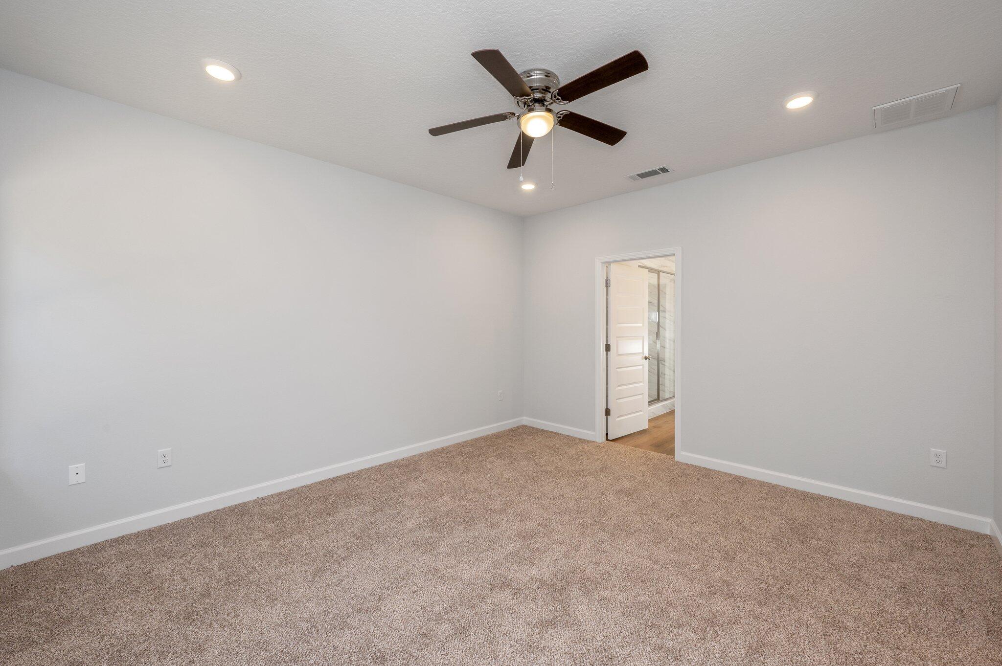 2614 Sorrel Ridge Road Crestview, FL 32536 - Photo 18 of 35 an empty room with ceiling fan and window