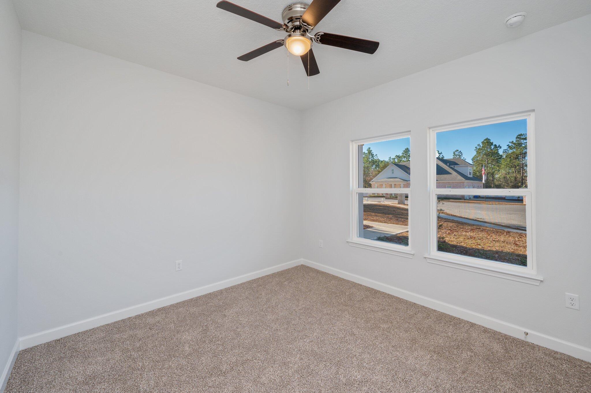 2614 Sorrel Ridge Road Crestview, FL 32536 - Photo 24 of 35 wooden floor in an empty room with a window