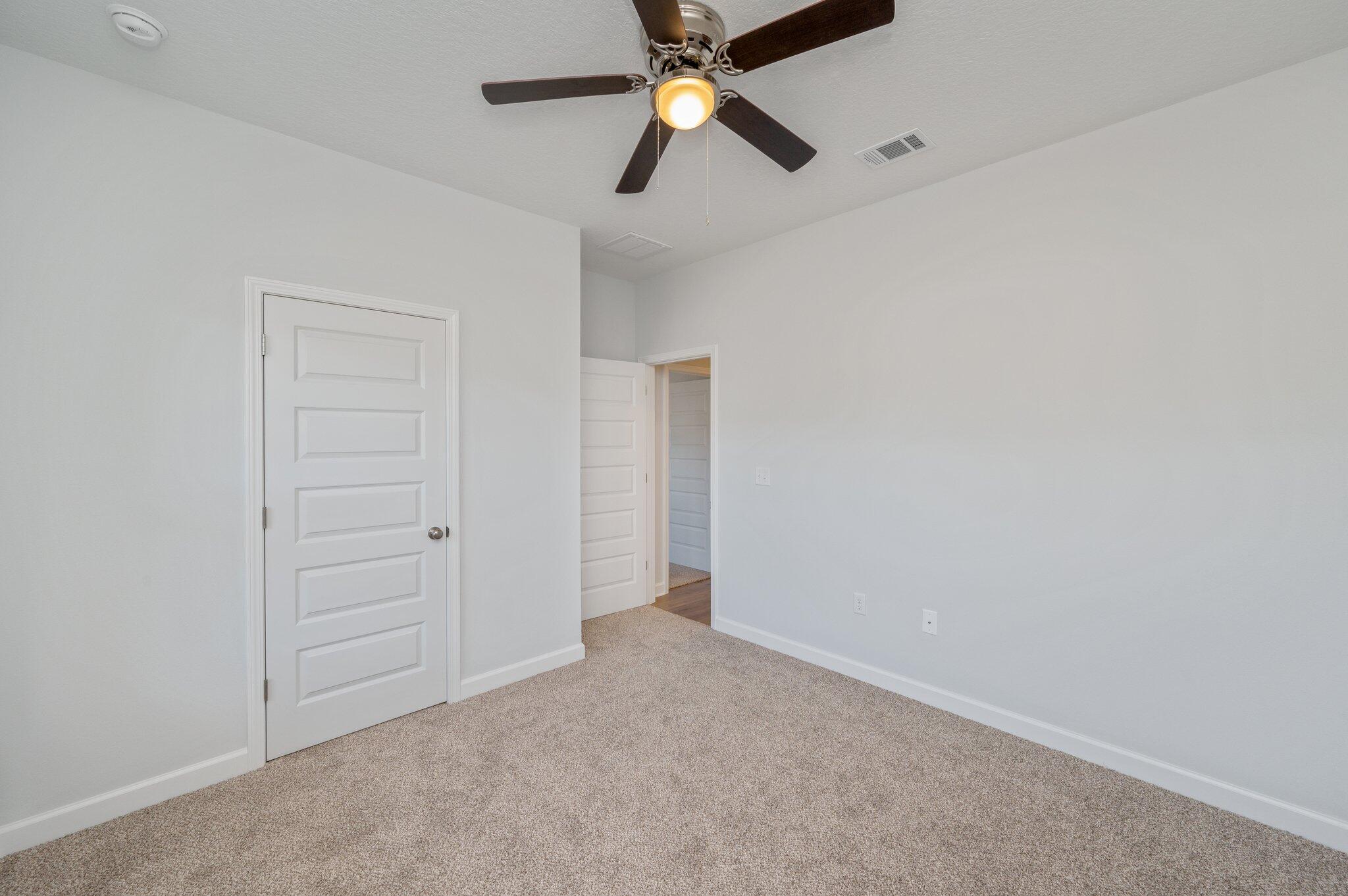 2614 Sorrel Ridge Road Crestview, FL 32536 - Photo 25 of 35 an empty room with closet and a ceiling fan