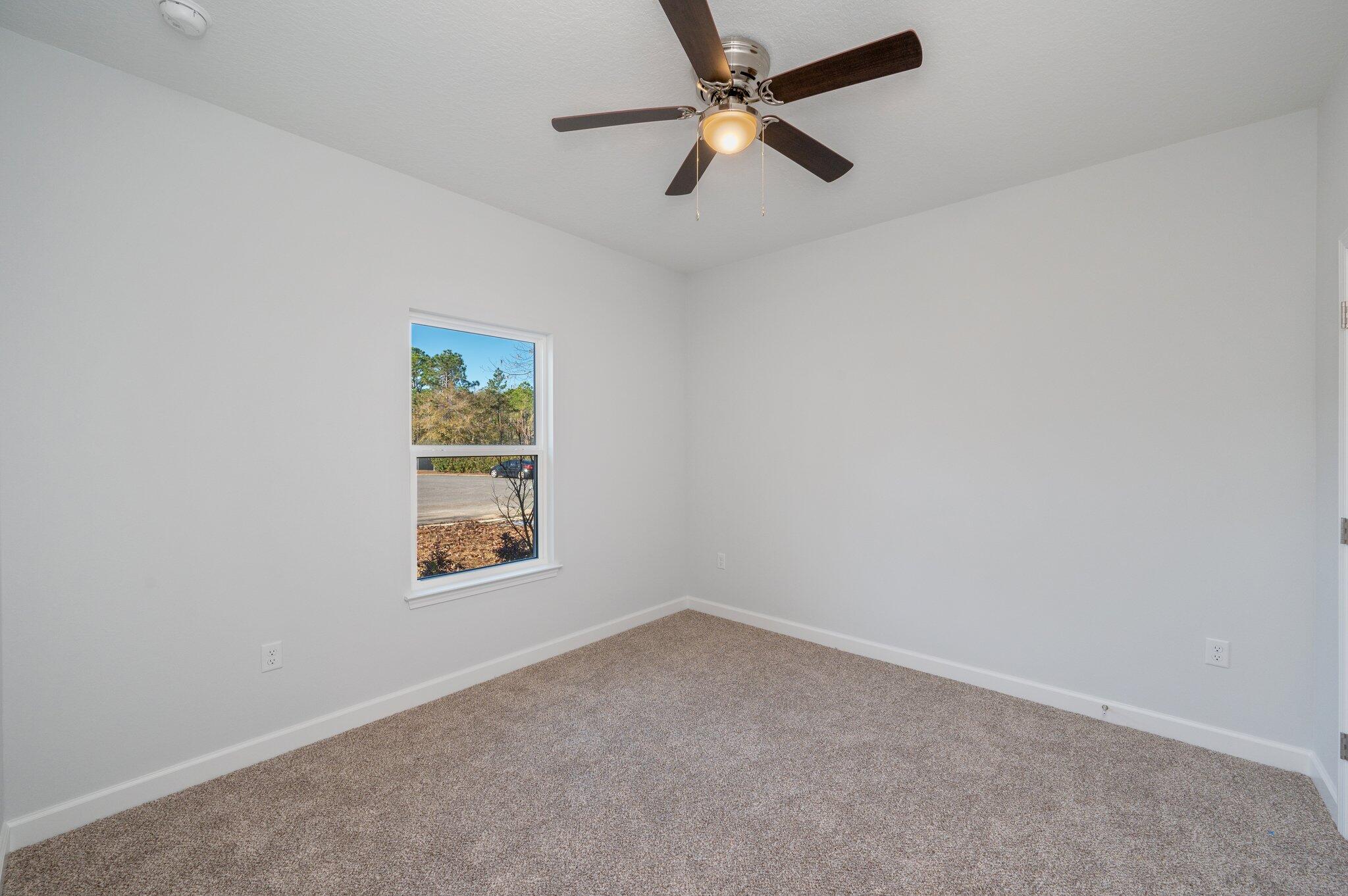2614 Sorrel Ridge Road Crestview, FL 32536 - Photo 26 of 35 an empty room with a window and a fan