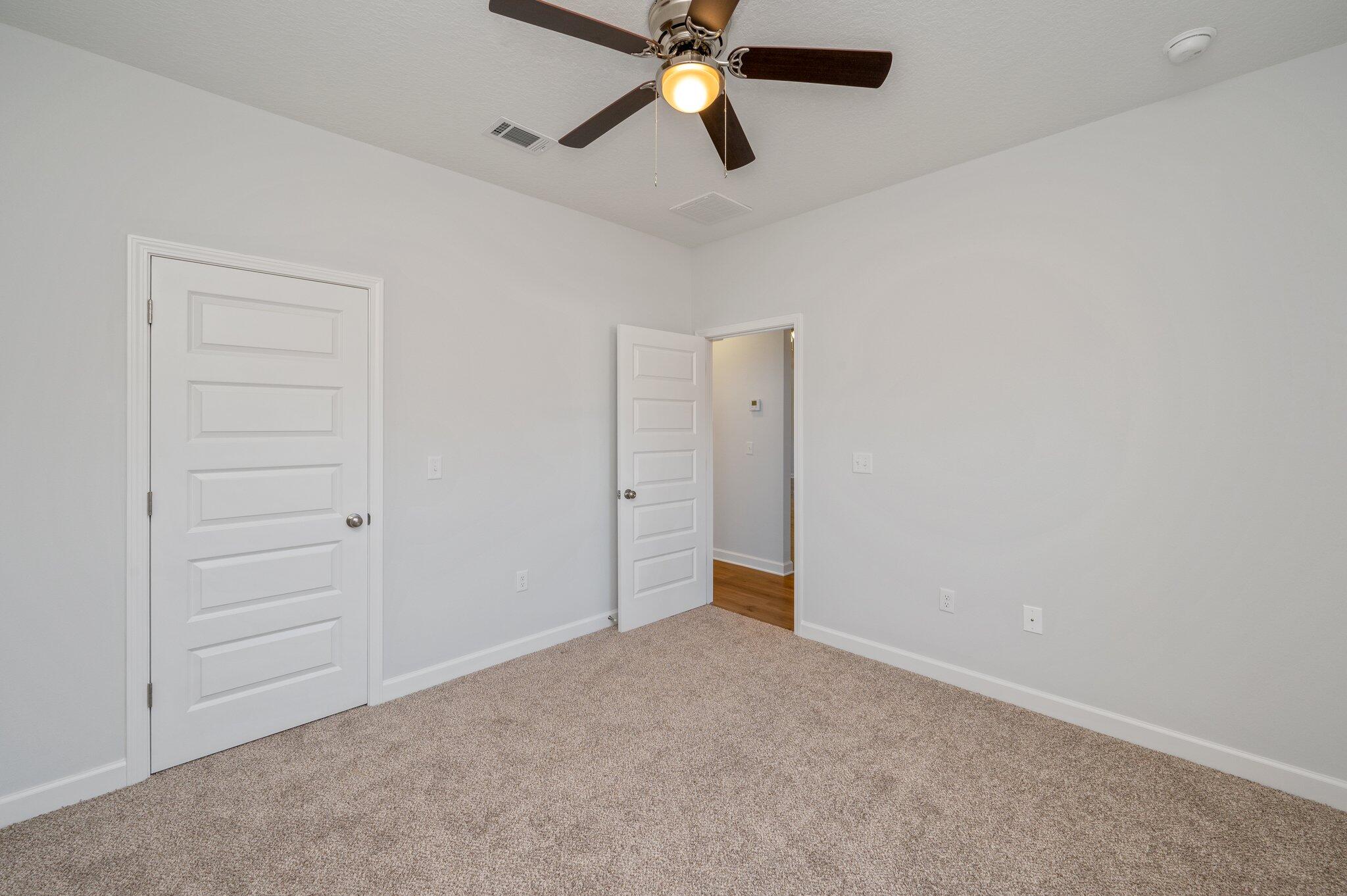 2614 Sorrel Ridge Road Crestview, FL 32536 - Photo 27 of 35 a view of an empty room and chandelier fan
