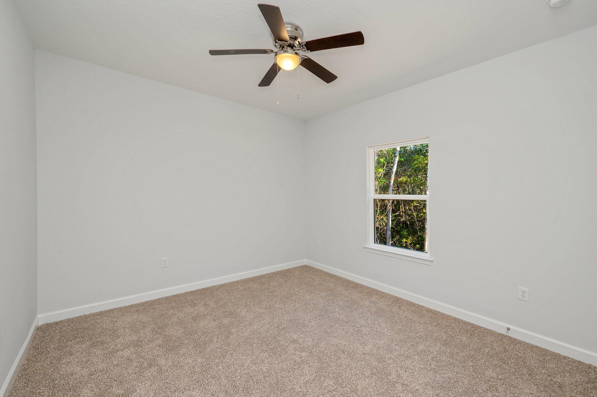 2614 Sorrel Ridge Road Crestview, FL 32536 - Photo 28 of 35 an empty room with a window and a fan