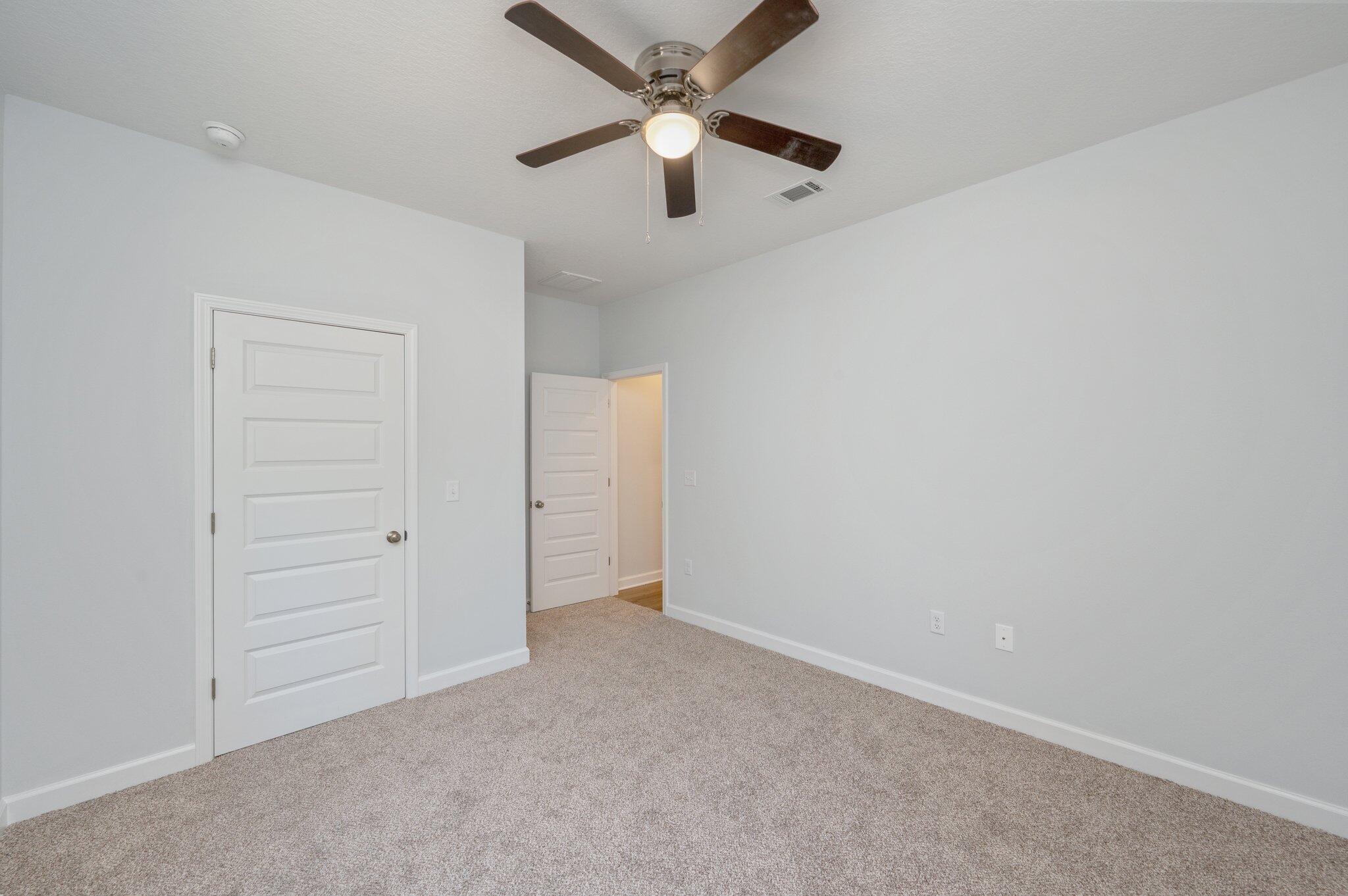 2614 Sorrel Ridge Road Crestview, FL 32536 - Photo 29 of 35 an empty room with closet and fan