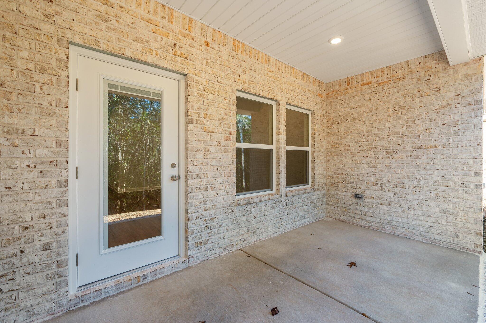 2614 Sorrel Ridge Road Crestview, FL 32536 - Photo 32 of 35 a view of a brick house with a door