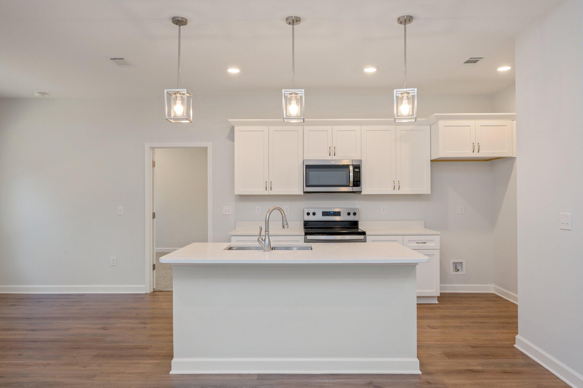 2614 Sorrel Ridge Road Crestview, FL 32536 - Photo 9 of 35 a kitchen with kitchen island a sink stainless steel appliances and cabinets