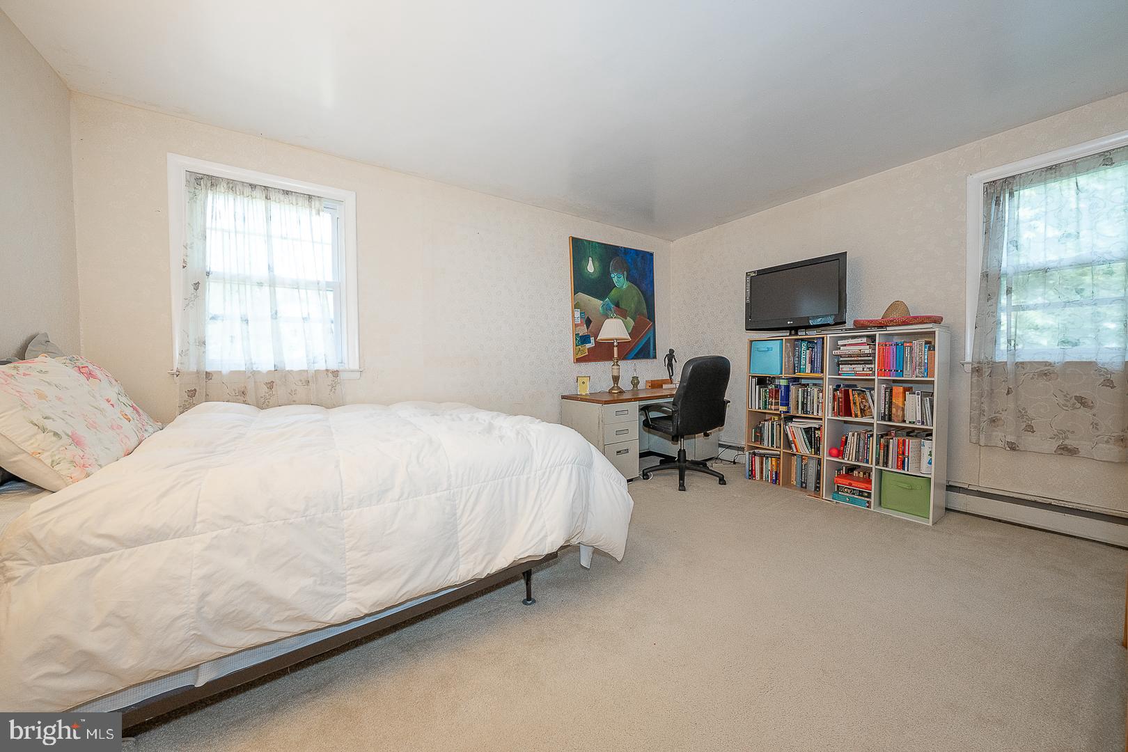 323 Hidden River Road Penn Valley, PA 19072 - Photo 14 of 29 a bed room with a bed and a chair