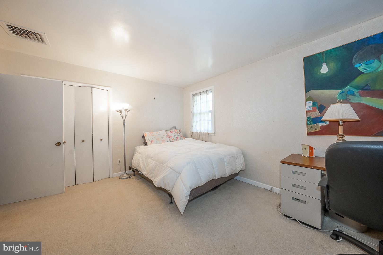 323 Hidden River Road Penn Valley, PA 19072 - Photo 15 of 29 a bedroom with a bed and a chair