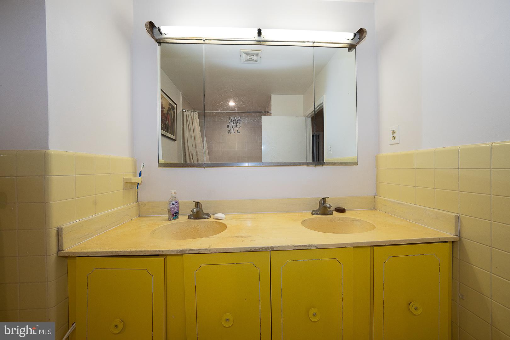 323 Hidden River Road Penn Valley, PA 19072 - Photo 16 of 29 a bathroom with a sink and a mirror