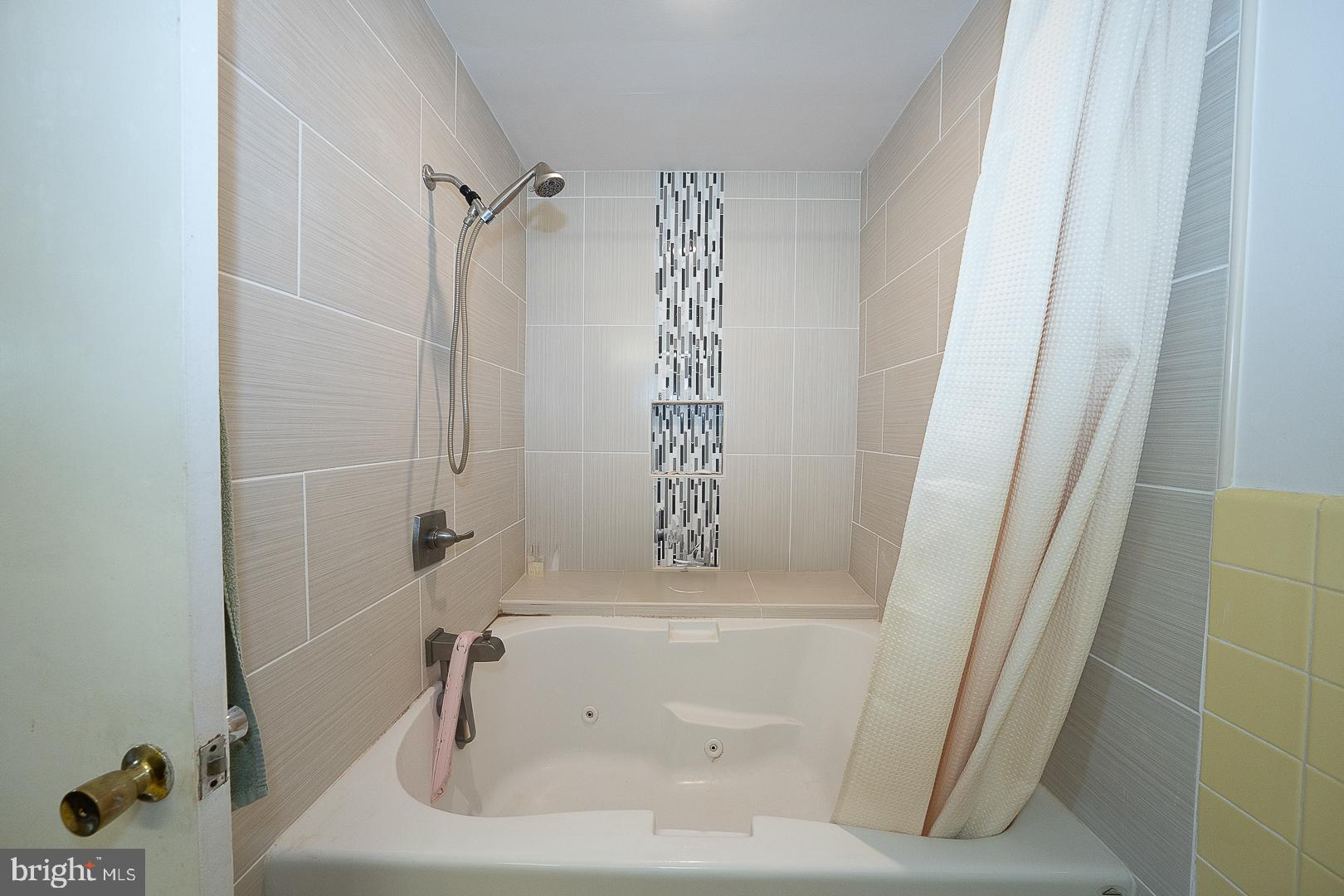 323 Hidden River Road Penn Valley, PA 19072 - Photo 17 of 29 a bathroom with a bathtub and shower