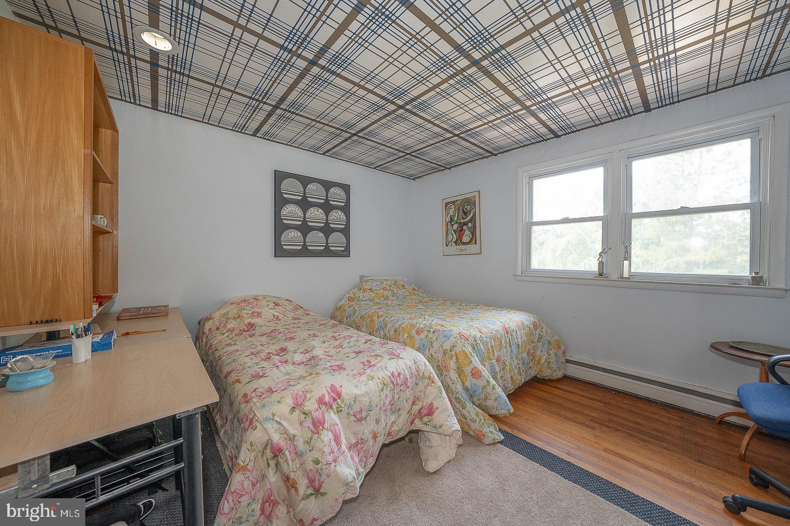 323 Hidden River Road Penn Valley, PA 19072 - Photo 18 of 29 a bedroom with bed and a window