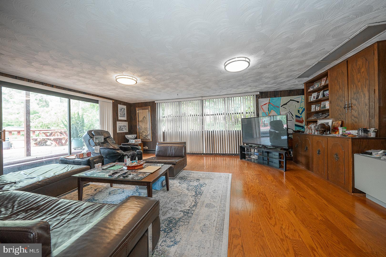 323 Hidden River Road Penn Valley, PA 19072 - Photo 23 of 29 a living room with furniture and a large window