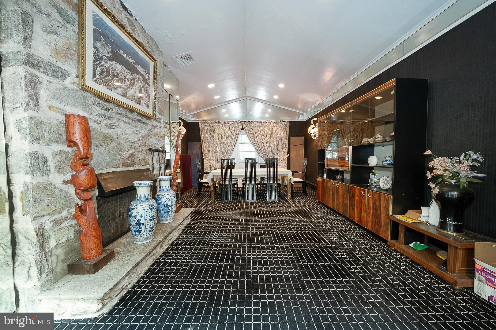 323 Hidden River Road Penn Valley, PA 19072 - Photo 5 of 29 a lobby with furniture and a fireplace