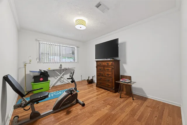 a bathroom with a granite countertop sink a mirror a shower and a bathtub