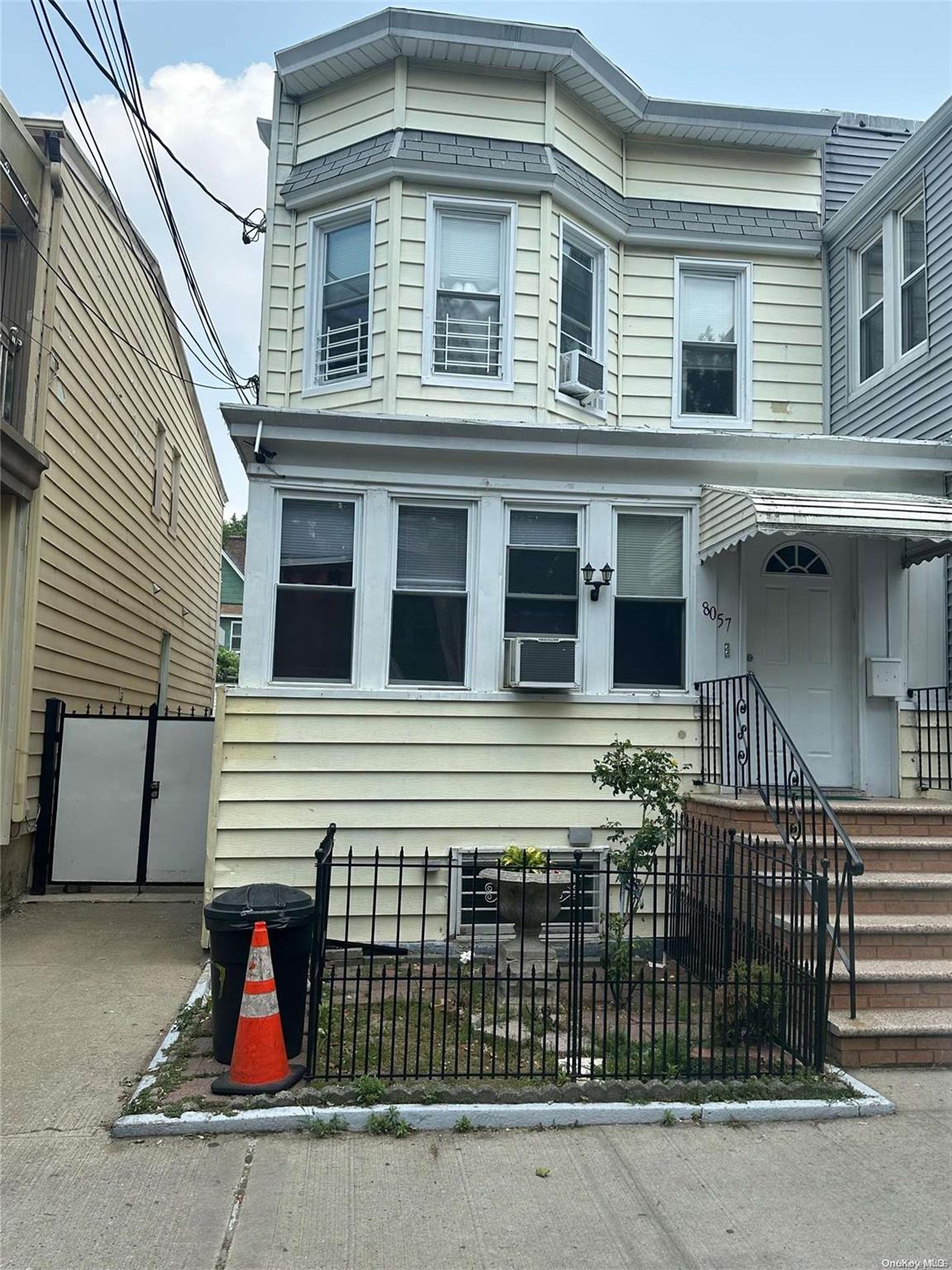 80-57 88th Road Queens, NY 11421 - Photo 1 of 1 a front view of a house