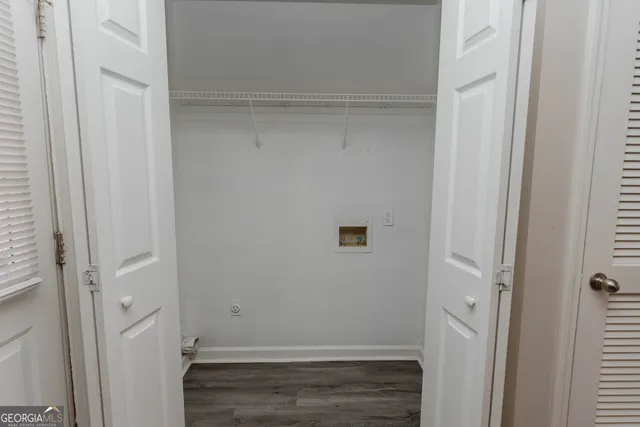 a kitchen with stainless steel appliances granite countertop wooden cabinets a stove top oven a sink and dishwasher