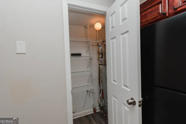 a kitchen with stainless steel appliances granite countertop a refrigerator microwave and sink