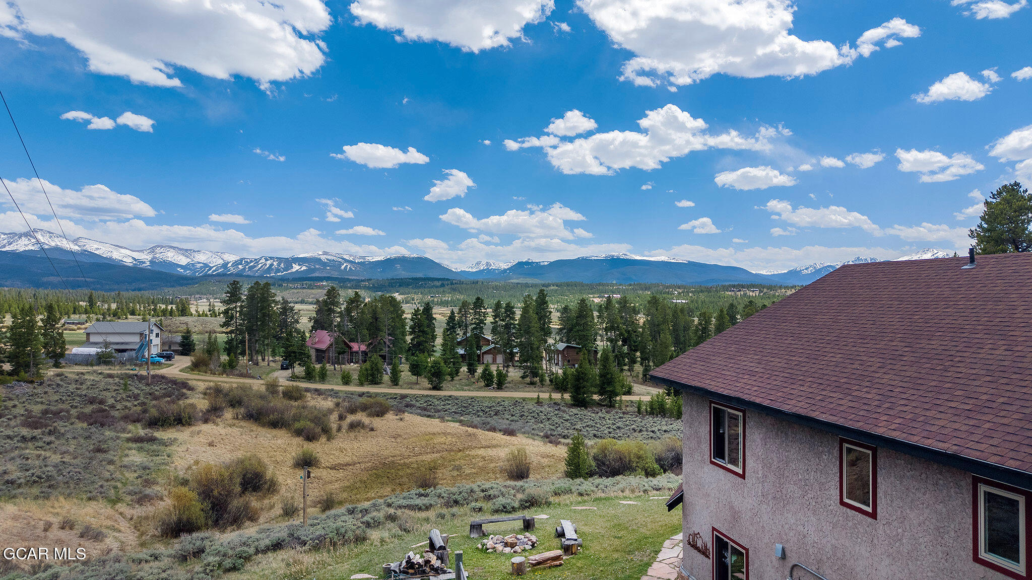 732 Gcr 8311/ Clayton Ranch Road Tabernash, CO 80478 - Photo 55 of 65 a view of a house with a yard and a large tree