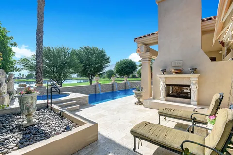 a view of a chairs and fire pit in the patio