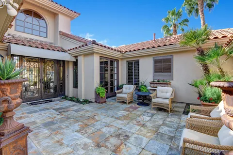 a front view of a house with patio