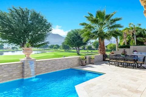 a view of a swimming pool with a patio