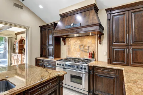 a kitchen with a stove and a microwave