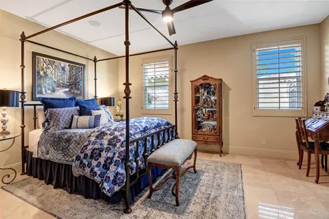 a bedroom with furniture and a window