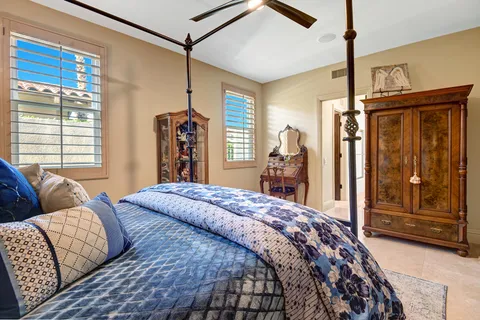 a bedroom with bed and walk in closet