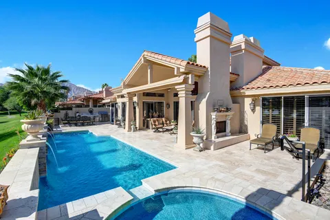 a view of a house with sitting area and furniture