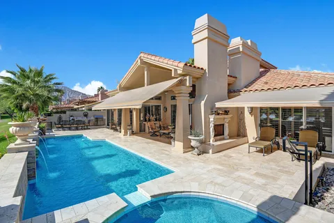a view of a house with sitting area and furniture