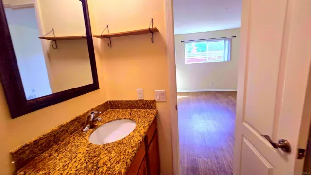 a bathroom with a sink and a mirror