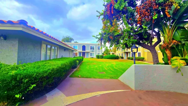 a view of yard with swimming pool and green space