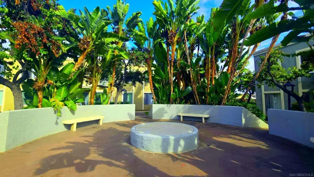a view of backyard with a table and a chairs