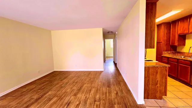 a view of a room with wooden floor and stairs