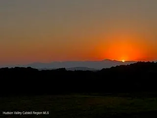 a view of sunset and yard