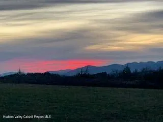 a view of swimming pool from a yard