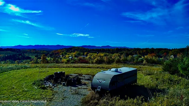 a view of a garden with an outdoor seating